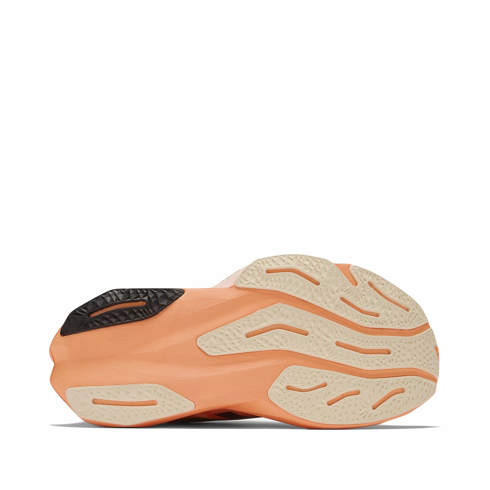 New Balance 530 Indigo And White New Balance Women's FuelCell Rebel v4 Sneaker in Hot Mango/Angora/Black