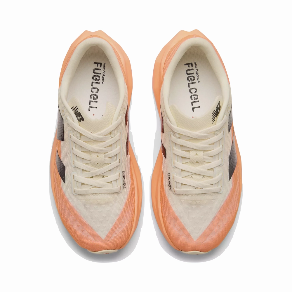 New Balance Women's FuelCell Rebel v4 Sneaker in Hot Mango/Angora/Black